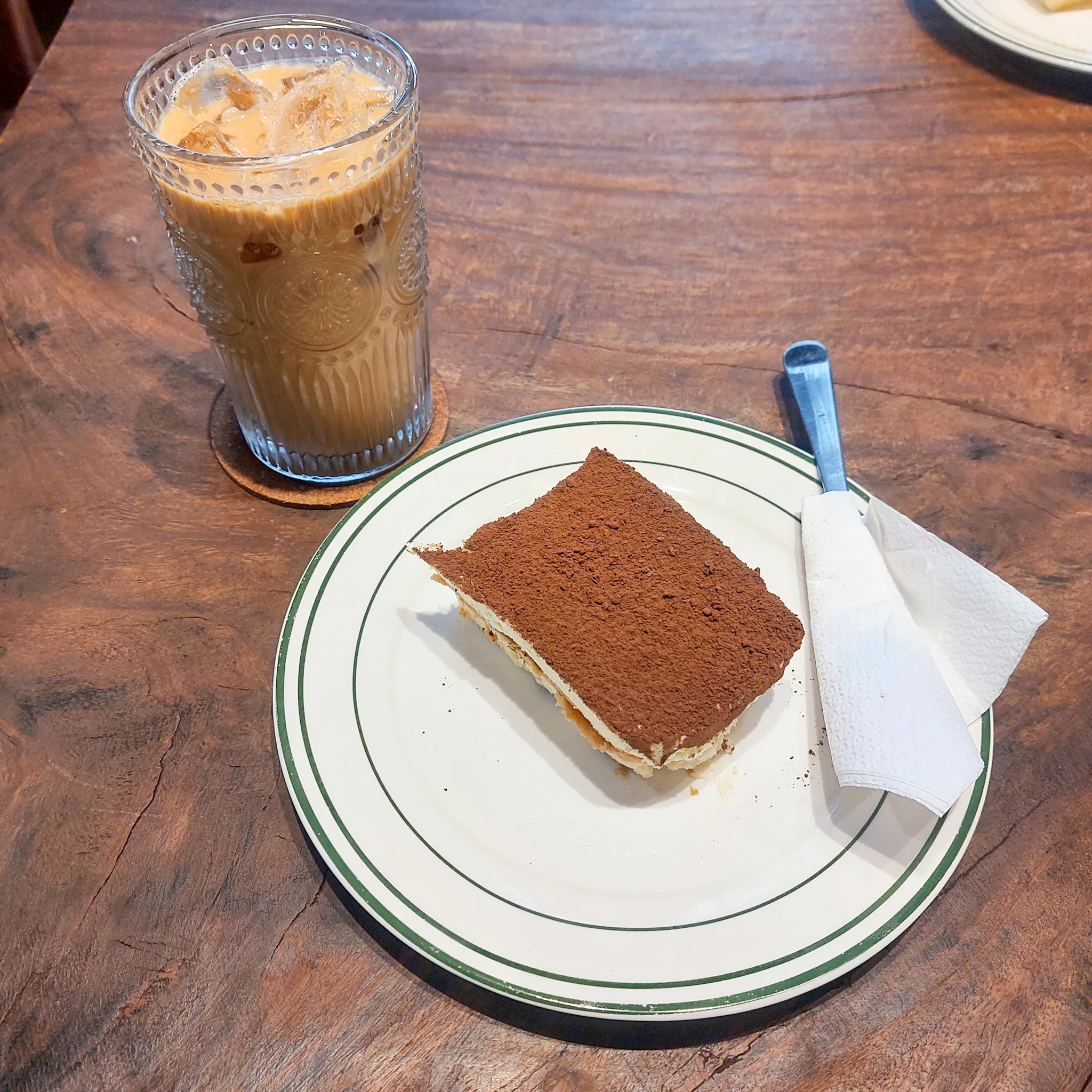 Iced oat latte and tiramisu at Sulok Coffee.